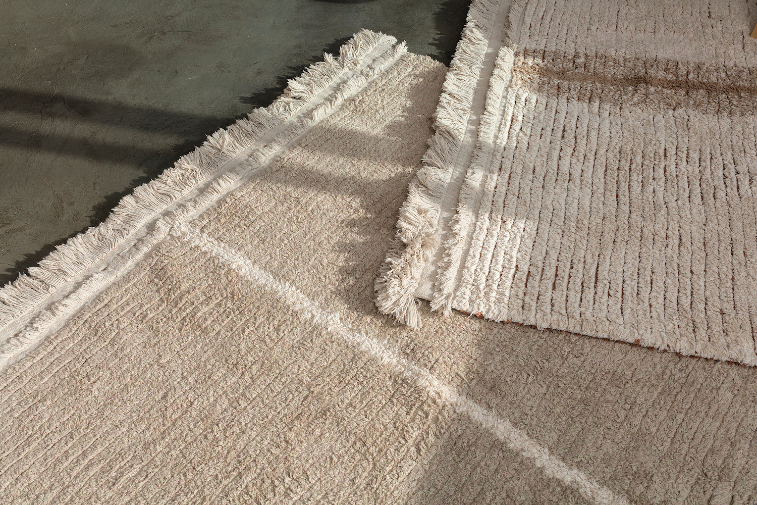 Reversible Washable Rug Duetto Sage. Fully reversible and washable cotton area rug with fray tassel edges in Natural, Olive, Sage, and Terracotta. 
