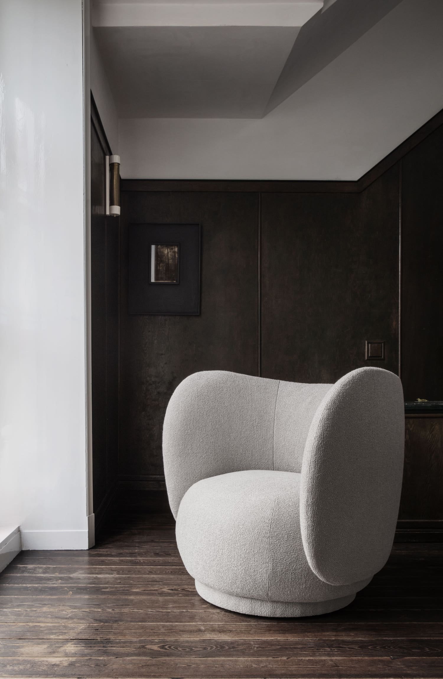A classic design with a welcome embrace, this single seater lounge chair features deep curves and soft lines in an upholstery of timeless, easeful bouclé fabric with a rich, loopy texture in creamy off-white. 