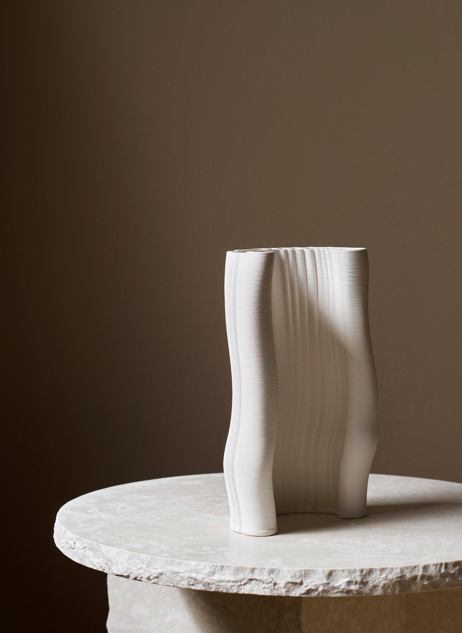 Moiré Vase. An inspired vase created through digital 3-D printing of clay, with thin layers that gradually form a subtle pattern. 