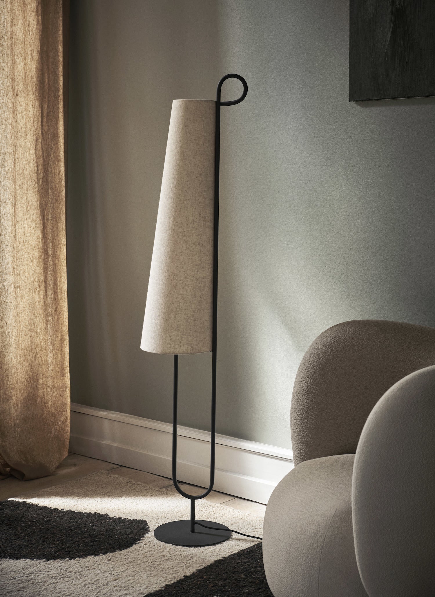 Ancora Floor Lamp. The Ancora Floor Lamp derives its name from the Italian word for 'anchor,' drawing inspiration from its distinctive shape. 