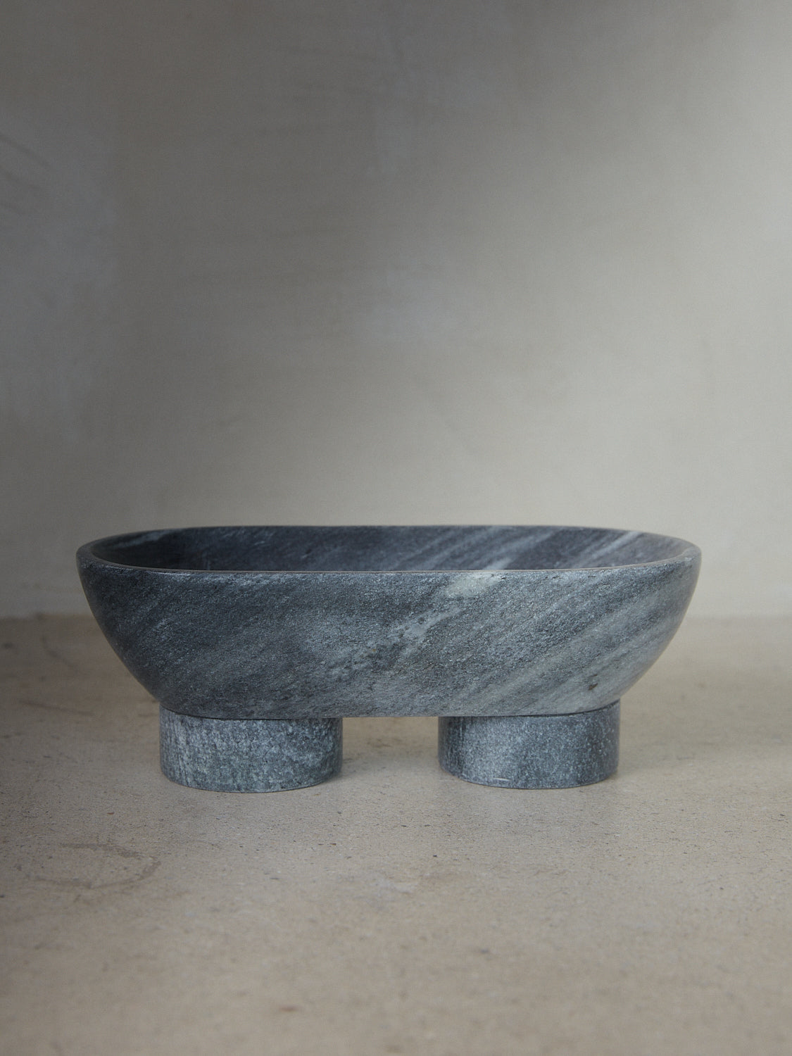 Black Alza Bowl. An oval shaped footed pedestal catch-all carved from Black Indian Selvara marble.