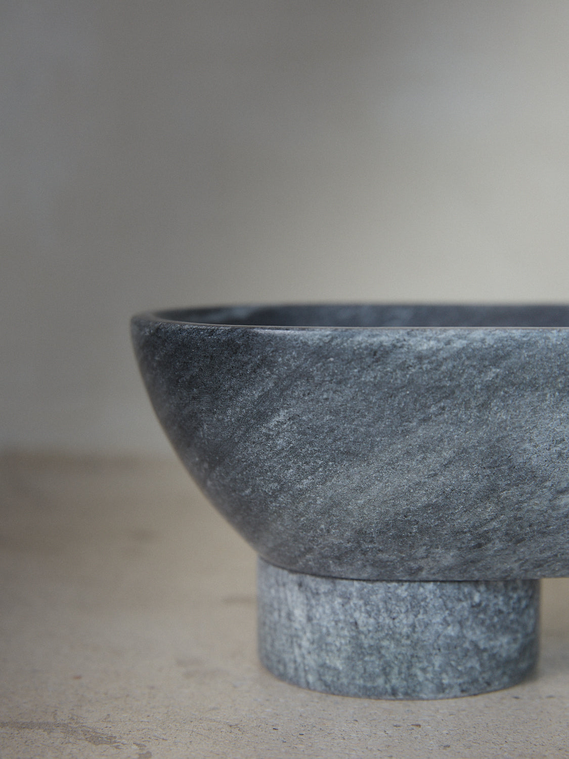 Black Alza Bowl. An oval shaped footed pedestal catch-all carved from Black Indian Selvara marble.