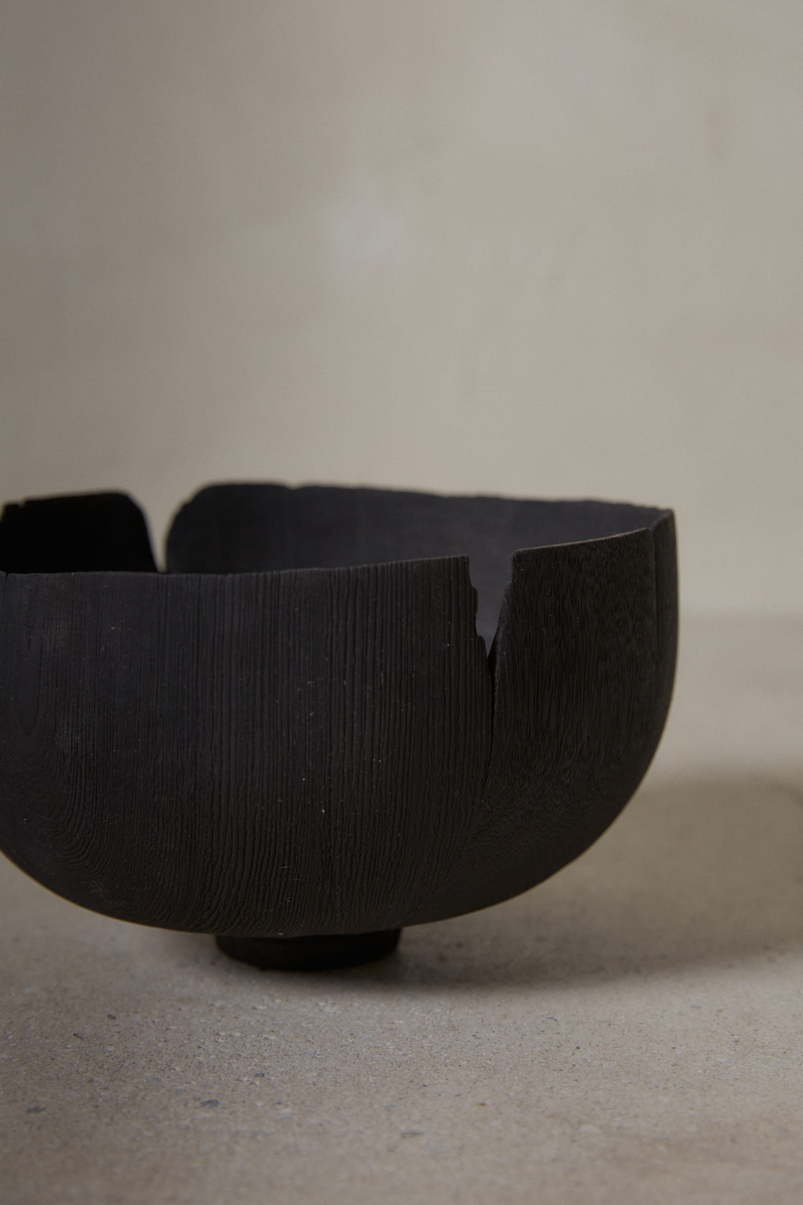 Raw edge wood details on footed black Yakisugi Bowl from CARMWORKS.