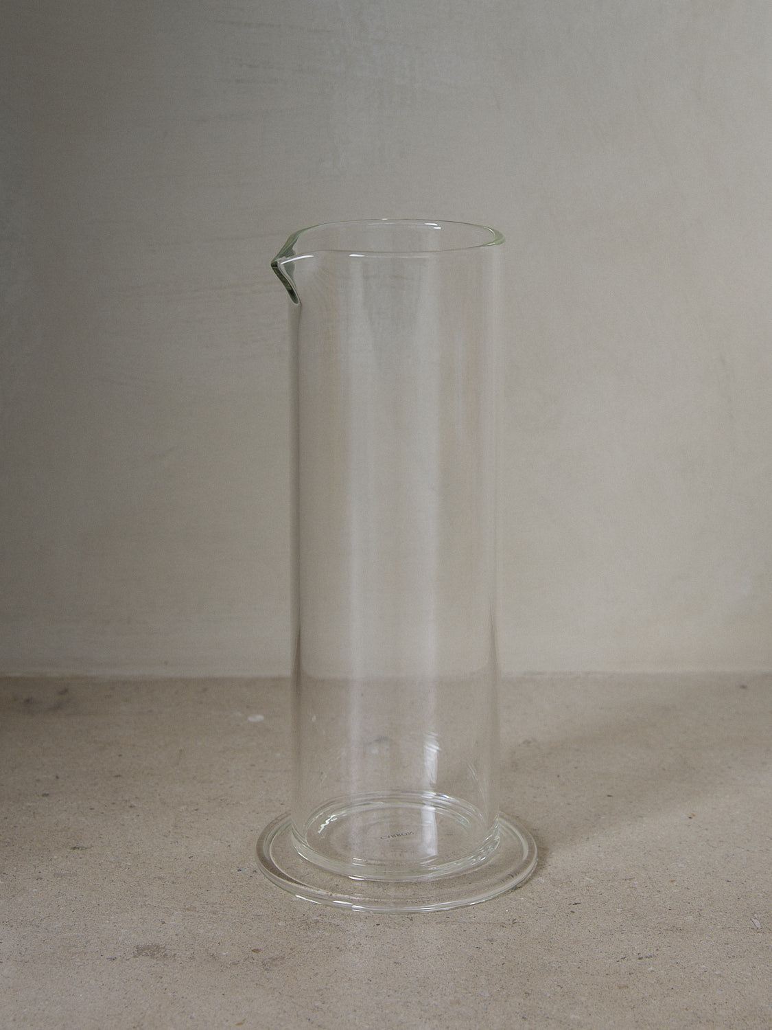 Paris Carafe. Casually elegant tall water carafe designed by Mathilde Carron-Astier de Villatte and individually mouth blown in borosilicate glass. 