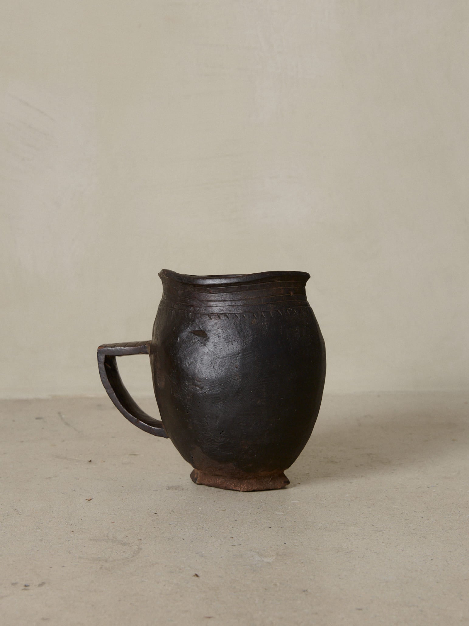 Anton Pitcher. Rare vintage find. Small, hand carved milk pitcher with artful etching details in dark natural wood. 