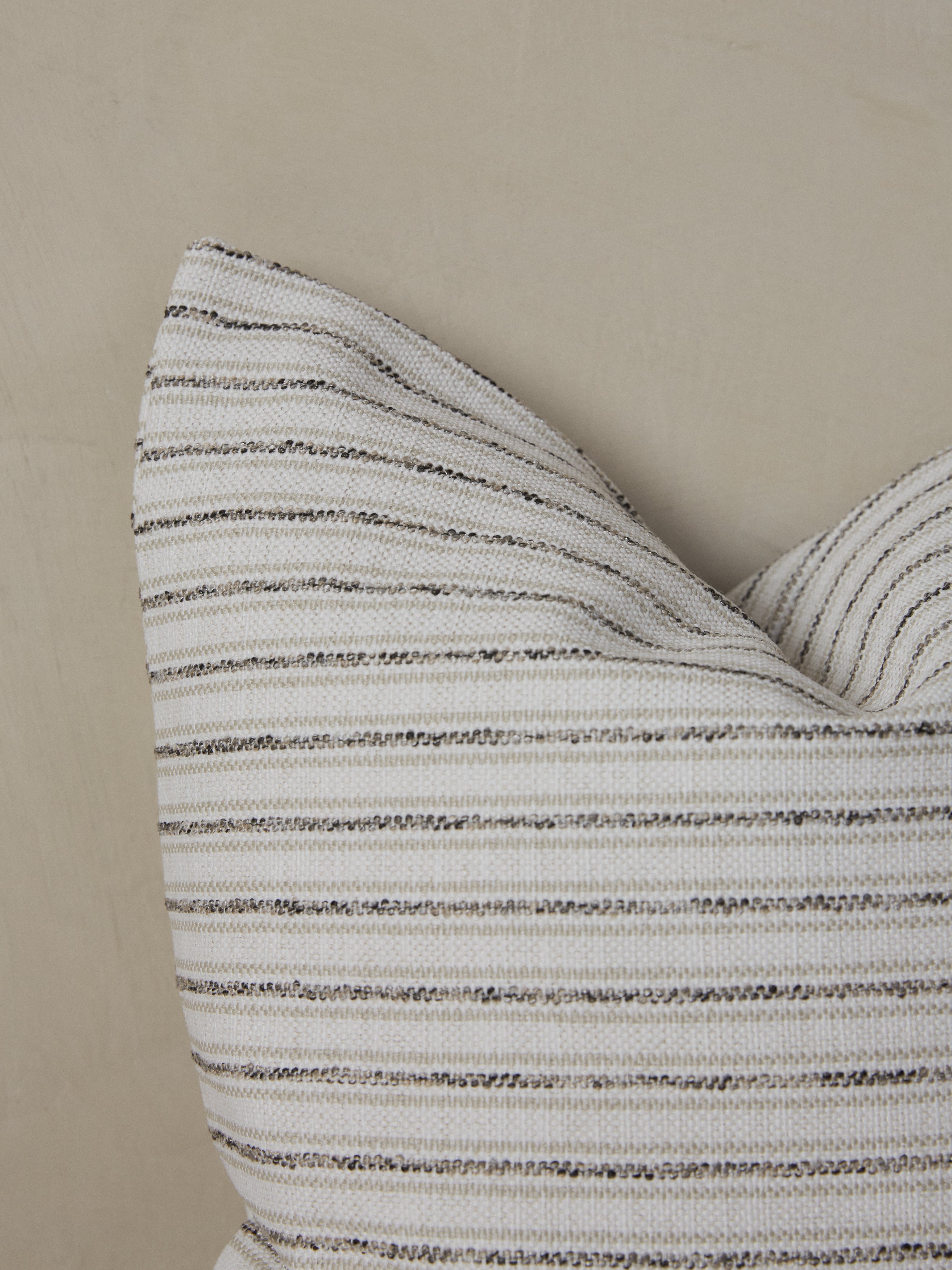 Black, white and neutral beige stripes on the Cambridge Pillow.