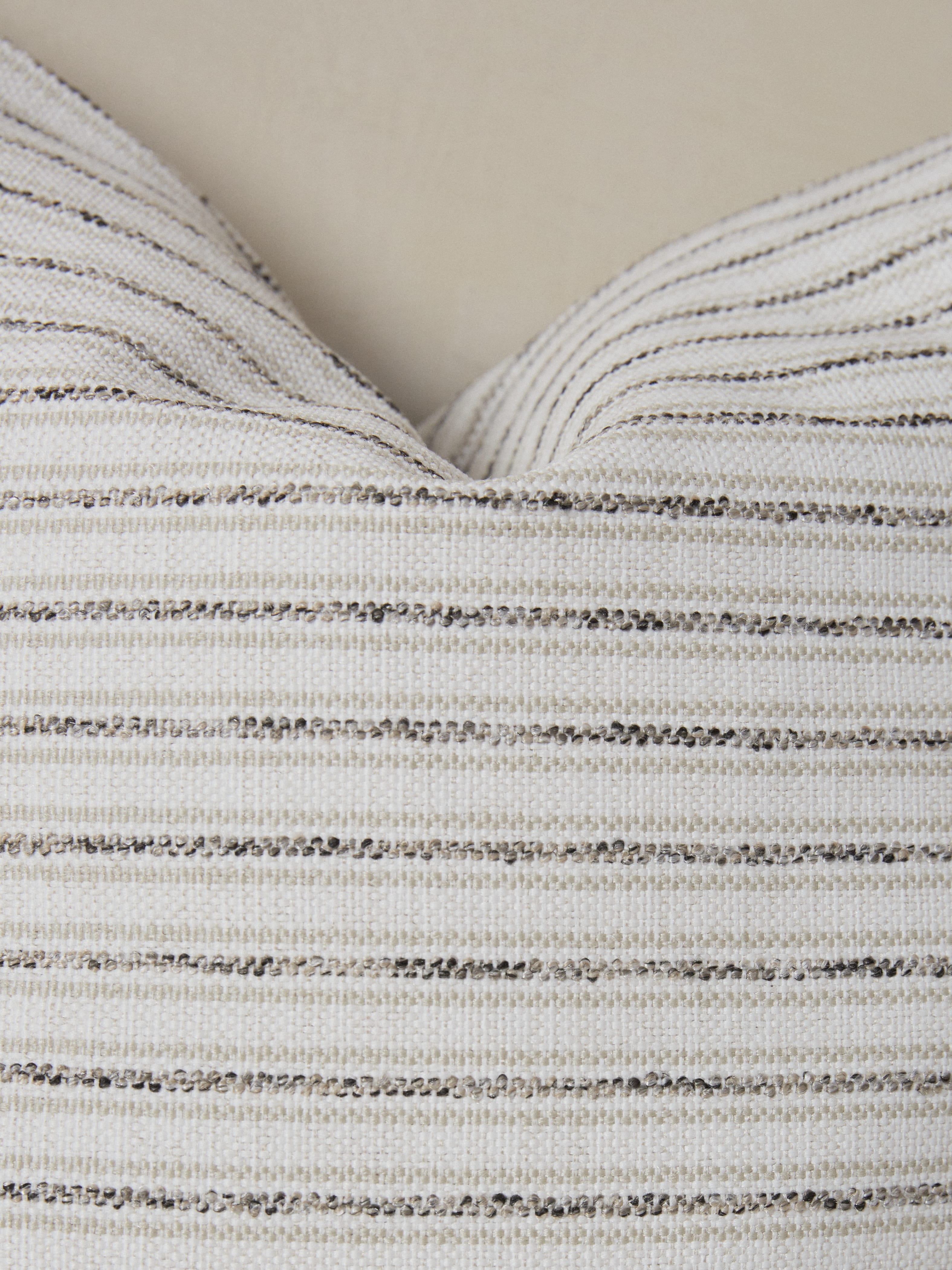 Textural details on the striped Cambridge Pillow.