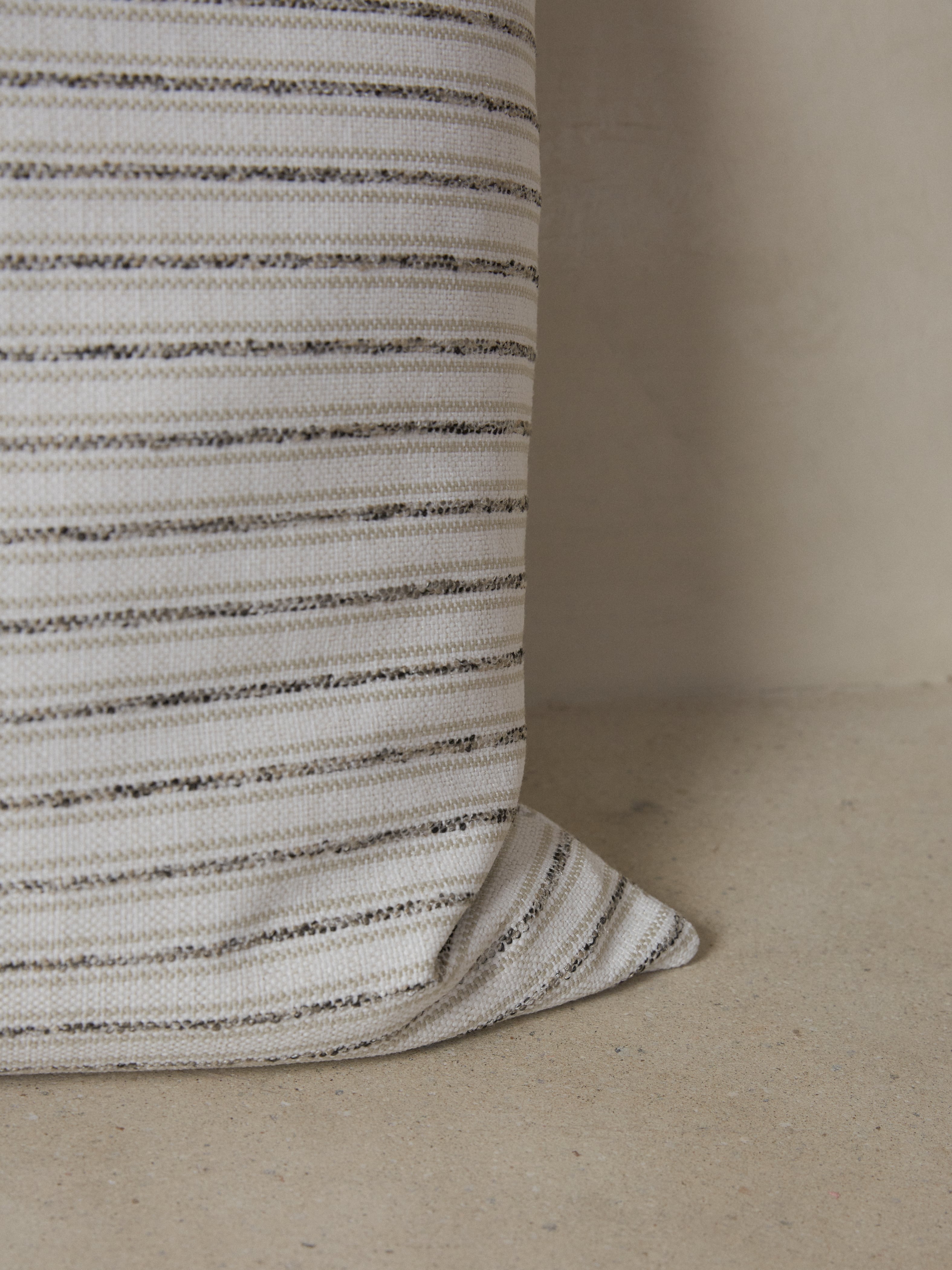 Fabric details on the striped Cambridge Pillow in Black, white and tan.