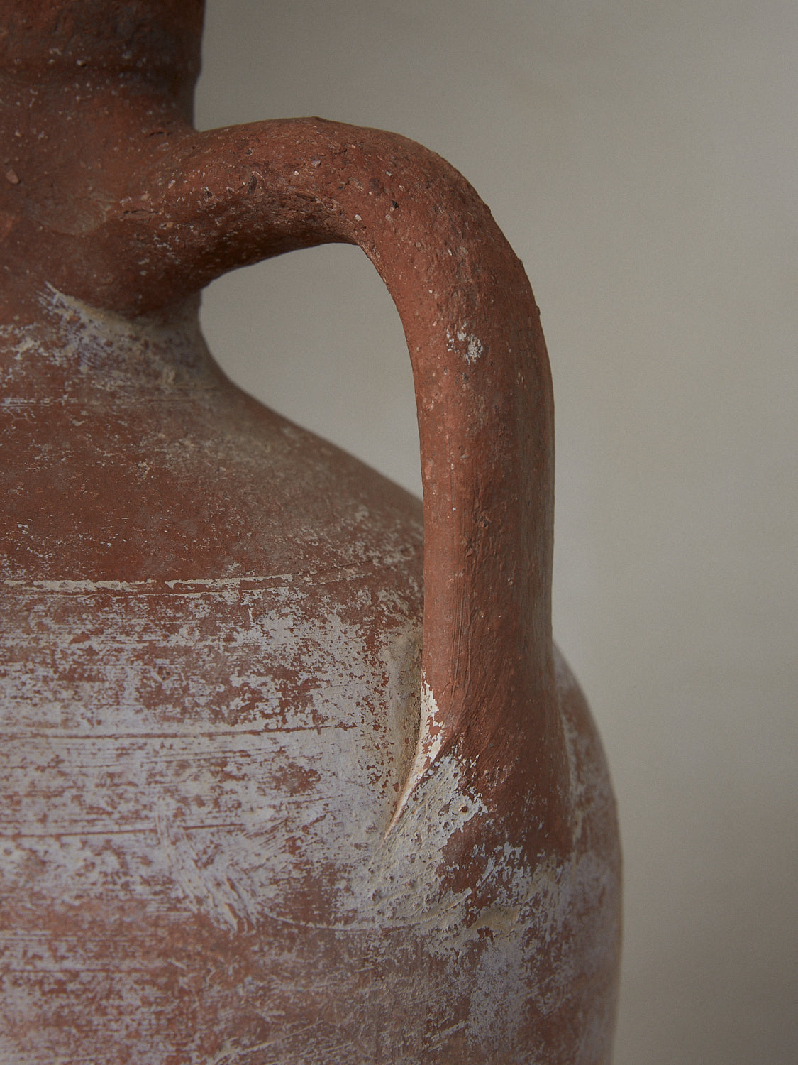 Charles Vessel. Rare vintage find. Ethereal antique Anatolian earthenware pitcher from the 1930's with classical bodice, handle and tapering at footing in aged terracotta.