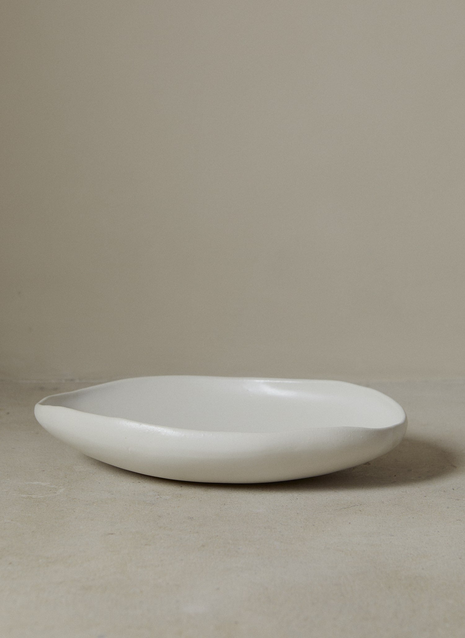 Large, oblong handmade serving bowl perfect for entertaining and everyday use in classic matte white stoneware. 