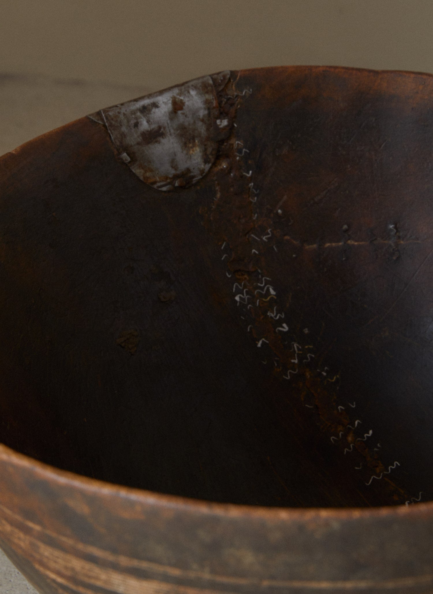 Interior repair detail of the Small Basile Bowl. 