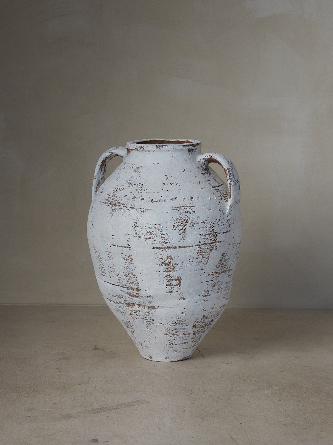 Vase Turque. Rare find. Large Turkish vessel with classical pitcher bodice and handles in aged white over terracotta clay. 