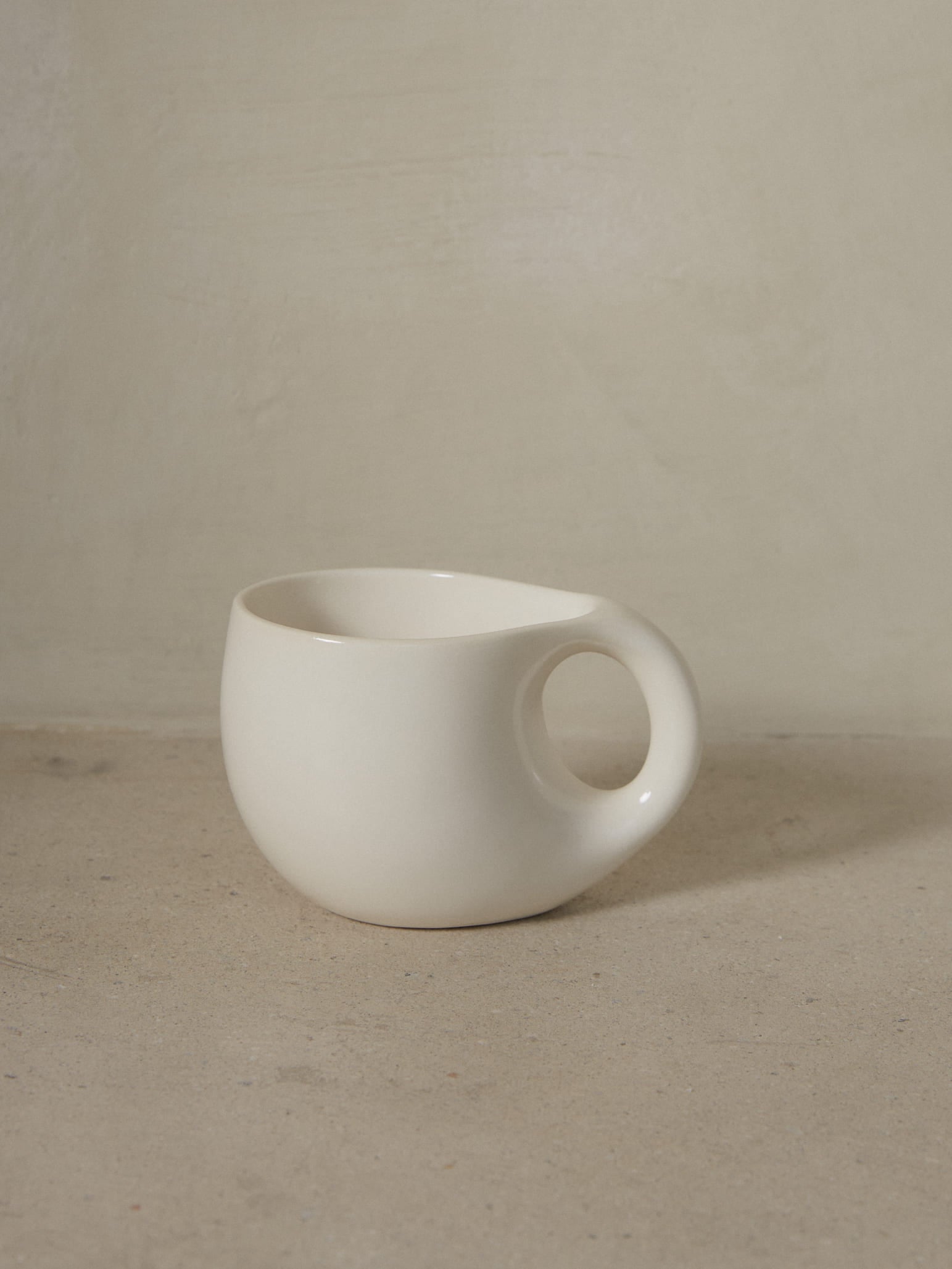 A sculptural, soothing mug embodying comfort and function that elevates the sipping experience to a sacred place. 