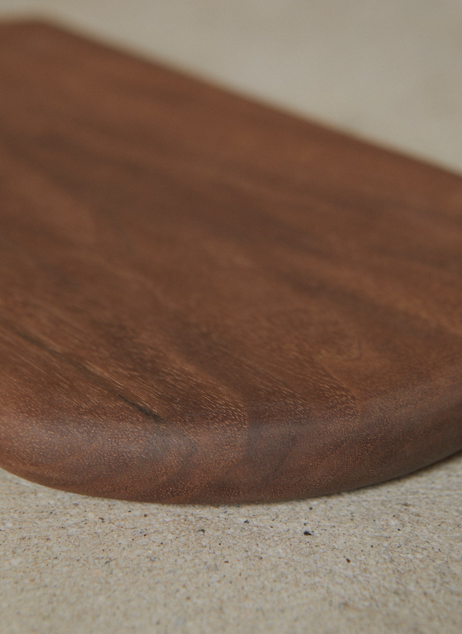 Carved edge detail on Walnut Shortboard.
