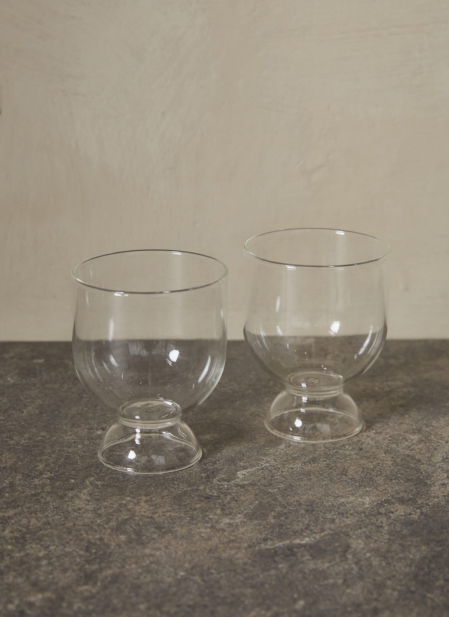 Still Glasses Set of 2. Rooted in simplicity and balance, this pair of gently rounded mouth-blown glasses feature an hourglass shape, making them ideal for wine as well as water.