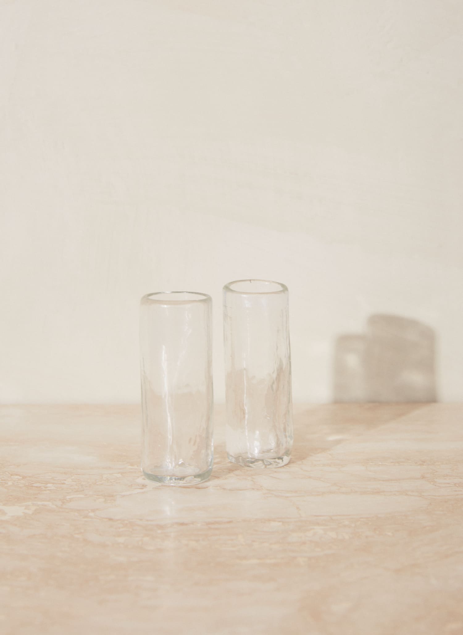 Organic Shot Glass. Tall and slim handblown shot glass designed for entertaining. Made from durable, lead-free recycled glass.
