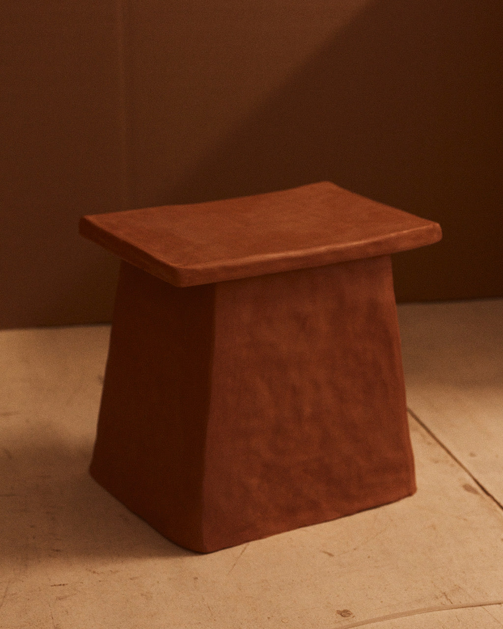 F. I. Structured Accent Table. One-of-a-kind. Angular ceramic end table with a burnished, red mud appearance in natural clay stoneware by Spanish artist Marta Bonilla.