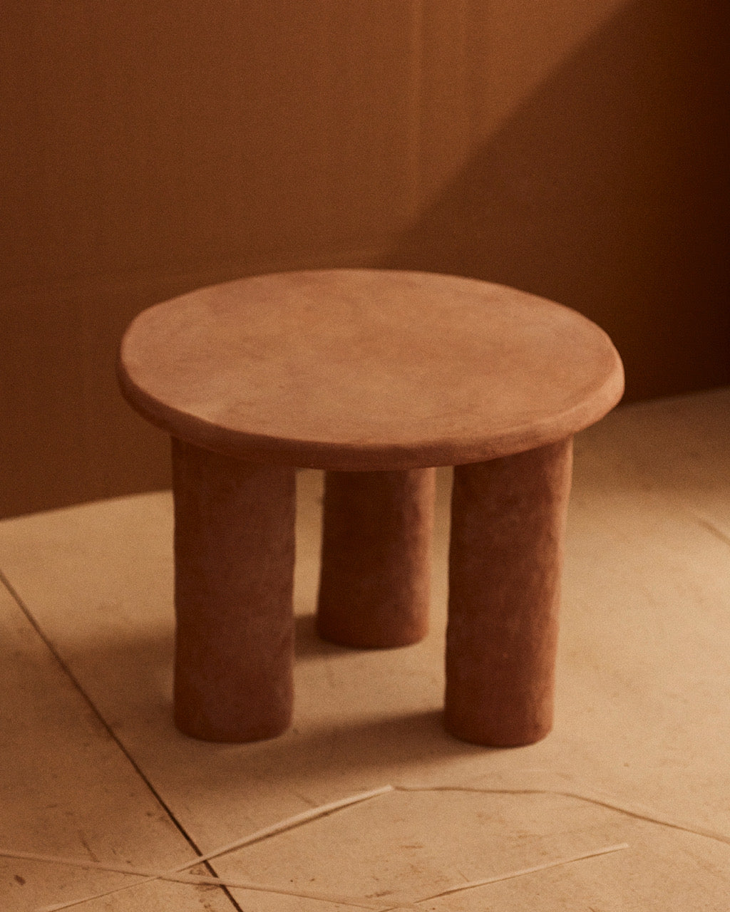 F. II. Ceramic Accent Table. One-of-a-kind. Round ceramic end table with a sculptural, hand-formed appearance in natural clay stoneware by Spanish artist Marta Bonilla.