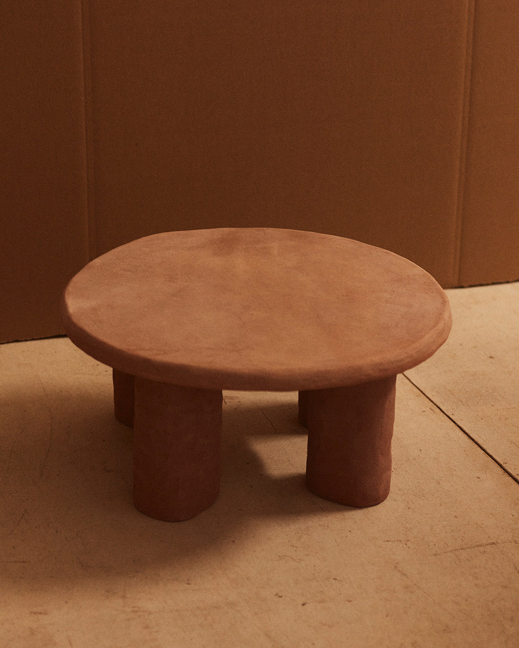 F. II Low. Ceramic Accent Table. One-of-a-kind. Low, round ceramic end table with a sculptural, hand-formed appearance in natural clay stoneware by Spanish artist Marta Bonilla. 