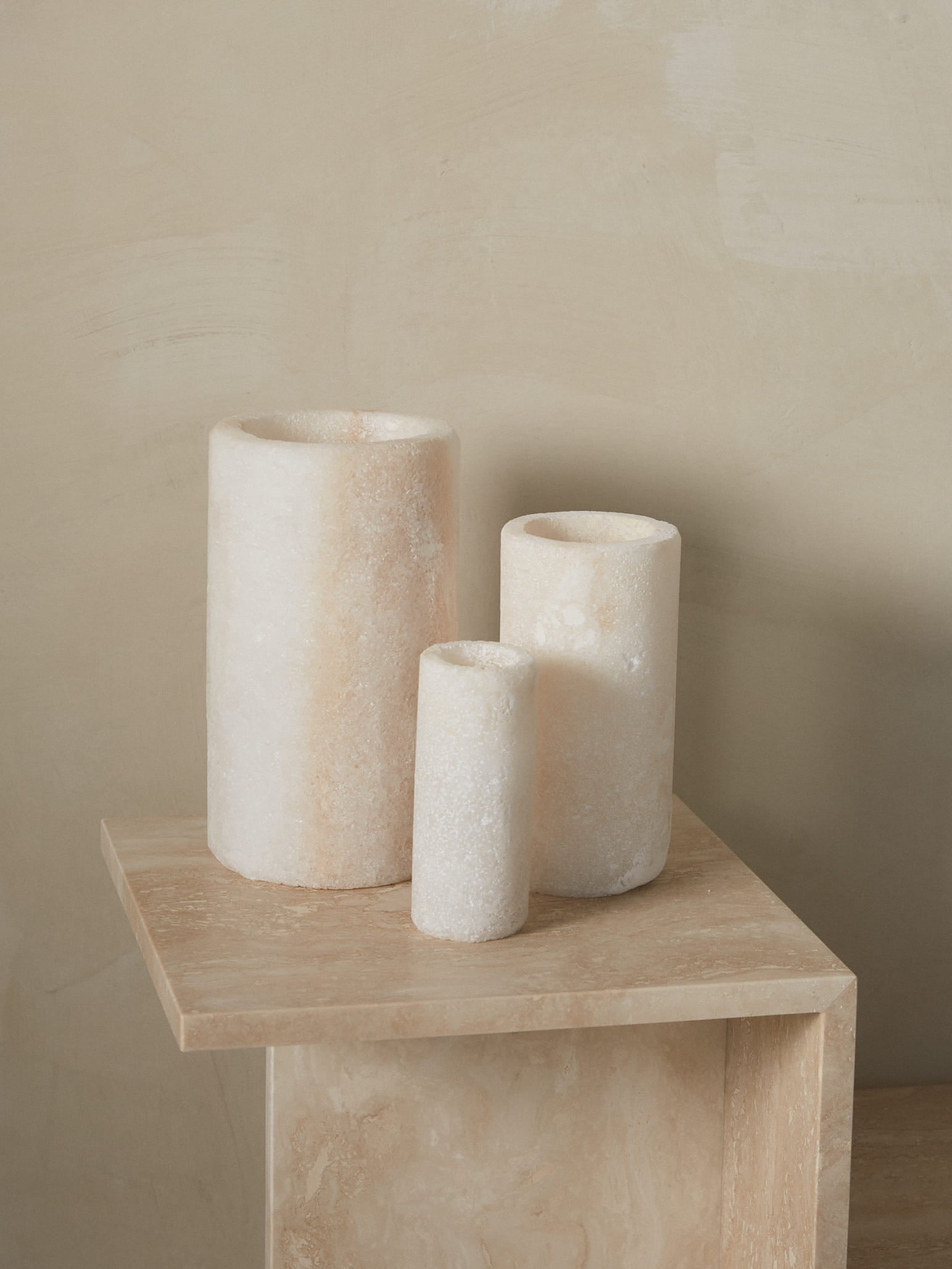  Tall cylindrical candleholder emitting soft, filtered light through natural crystals hand carved of compressed salt from the underground oasis of Siwa, Egypt. 
