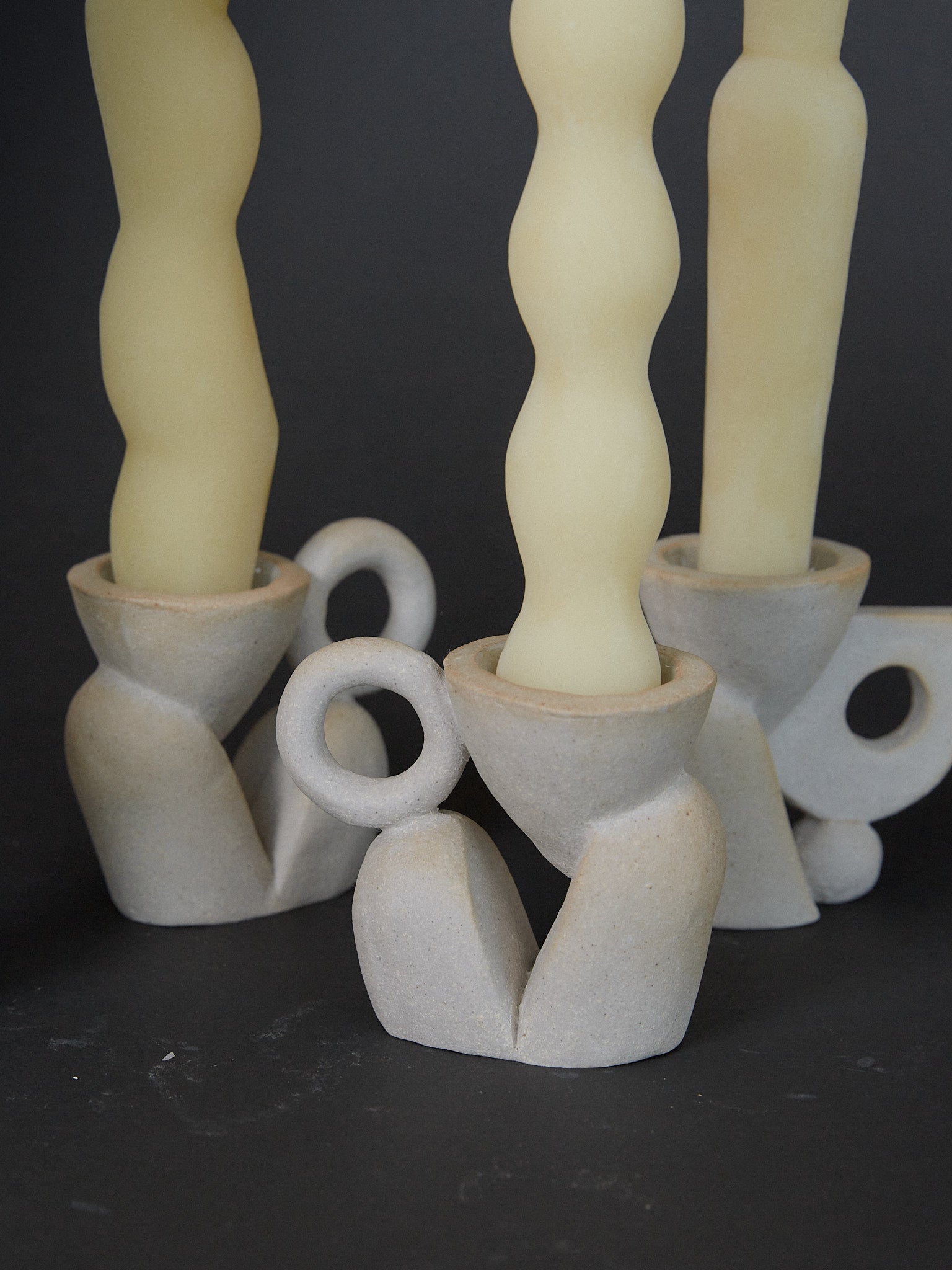 Bloom Candle Holder Pair. Sculptural abstract candleholders inspired by nature in natural grey ceramic stoneware. 