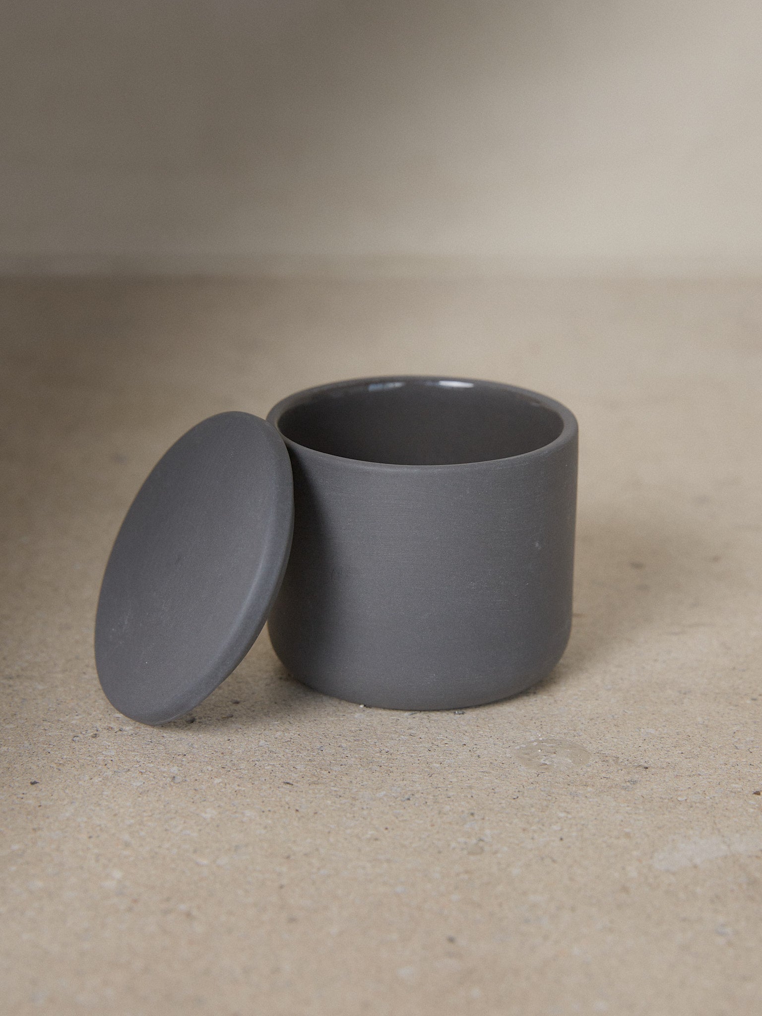 Dark Grey Round Cose Box. A study in refined simplicity, the Round Cose Box by Bertrand Lejoly for Serax adds subtle luxury to any bathroom or kitchen.
