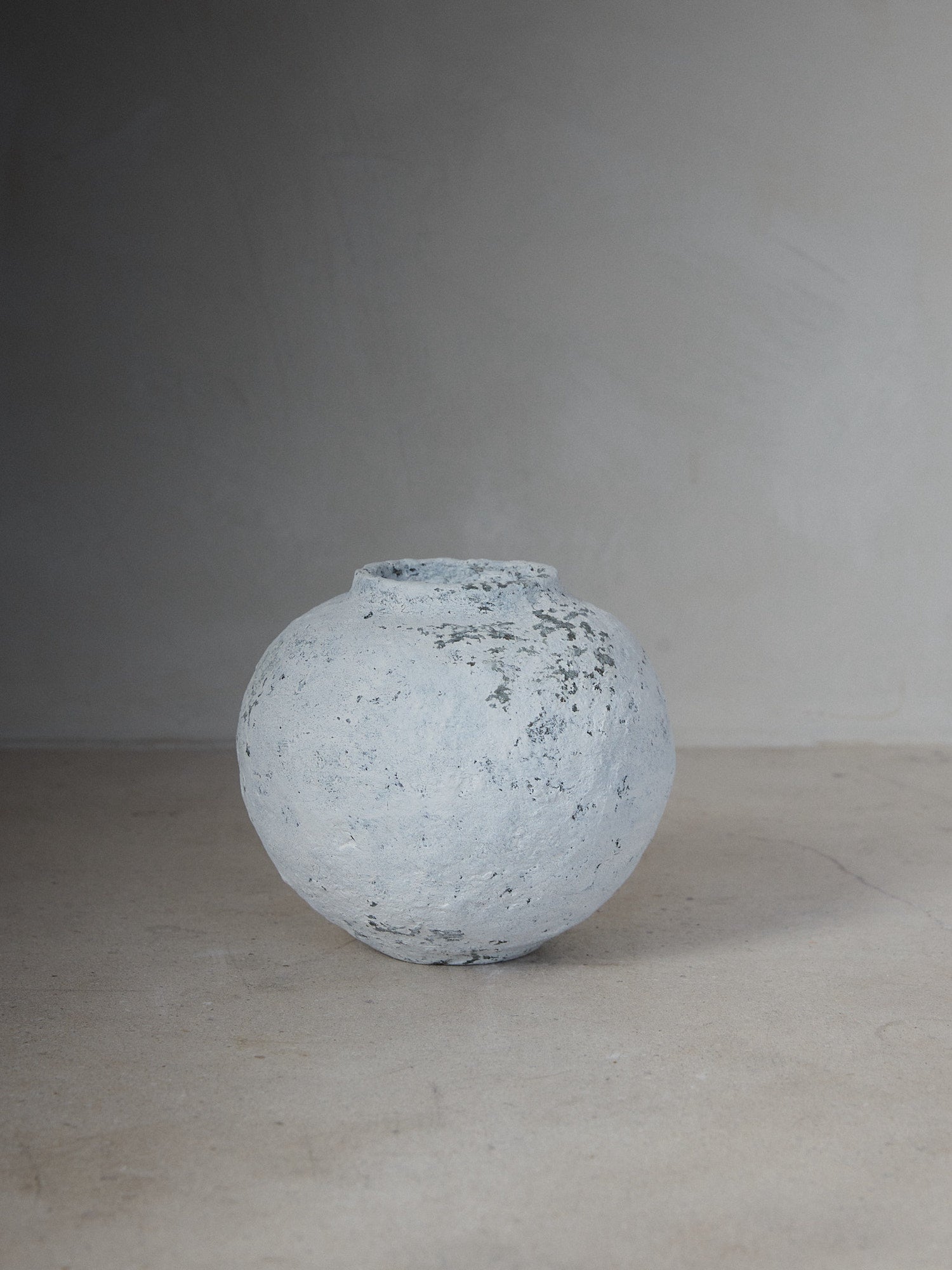 Abbot Vase. Rare find. Hand sculpted round vessel with an aged, crackle finish in natural white made from sustainable paper maché. 