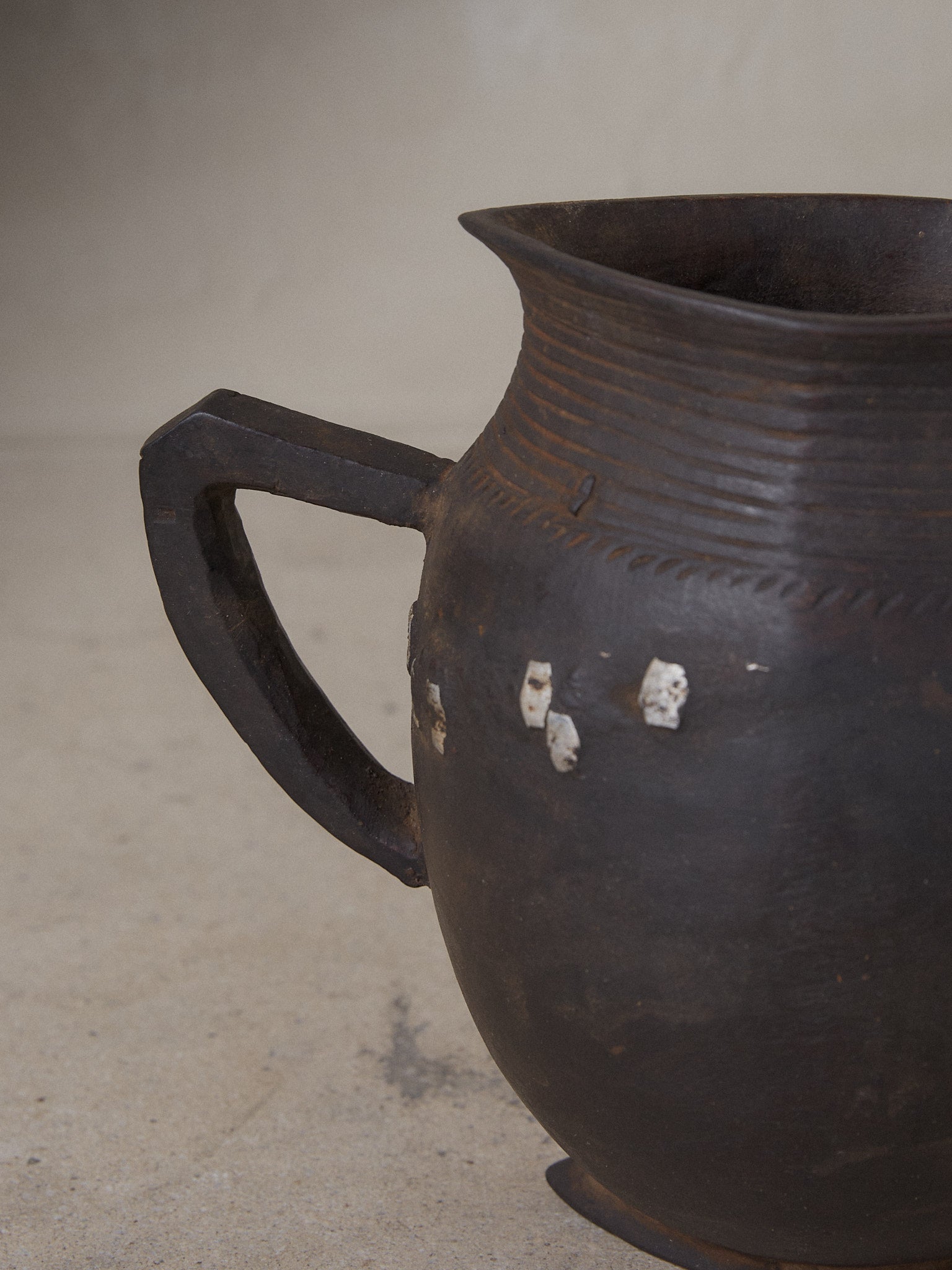 Anton Repair. Rare vintage find. Hand carved milk pitcher with artful etching and hand-forged metal repair details in dark natural wood.