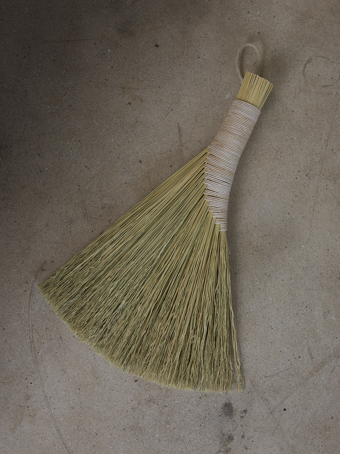 Neutral, rustic handwoven broom made from Sorghum and hemp cording in a classic Appalachian style.