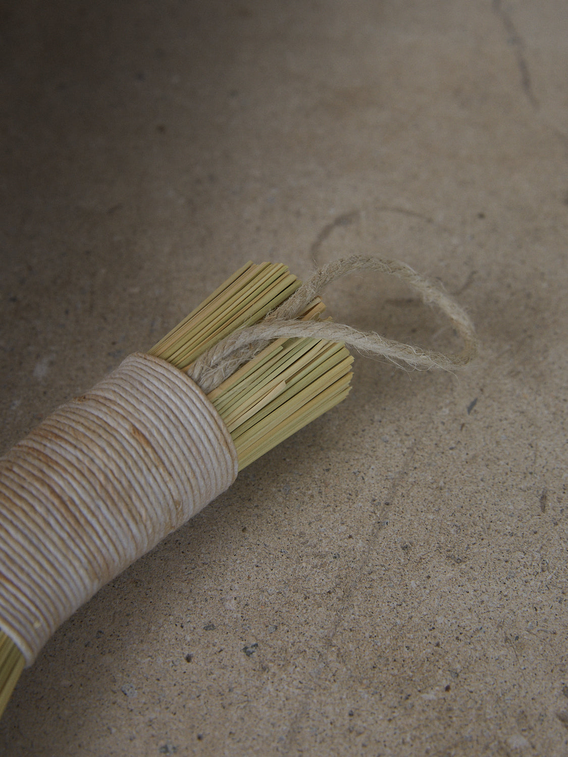 Neutral, rustic handwoven broom made from Sorghum and hemp cording in a classic Appalachian style.