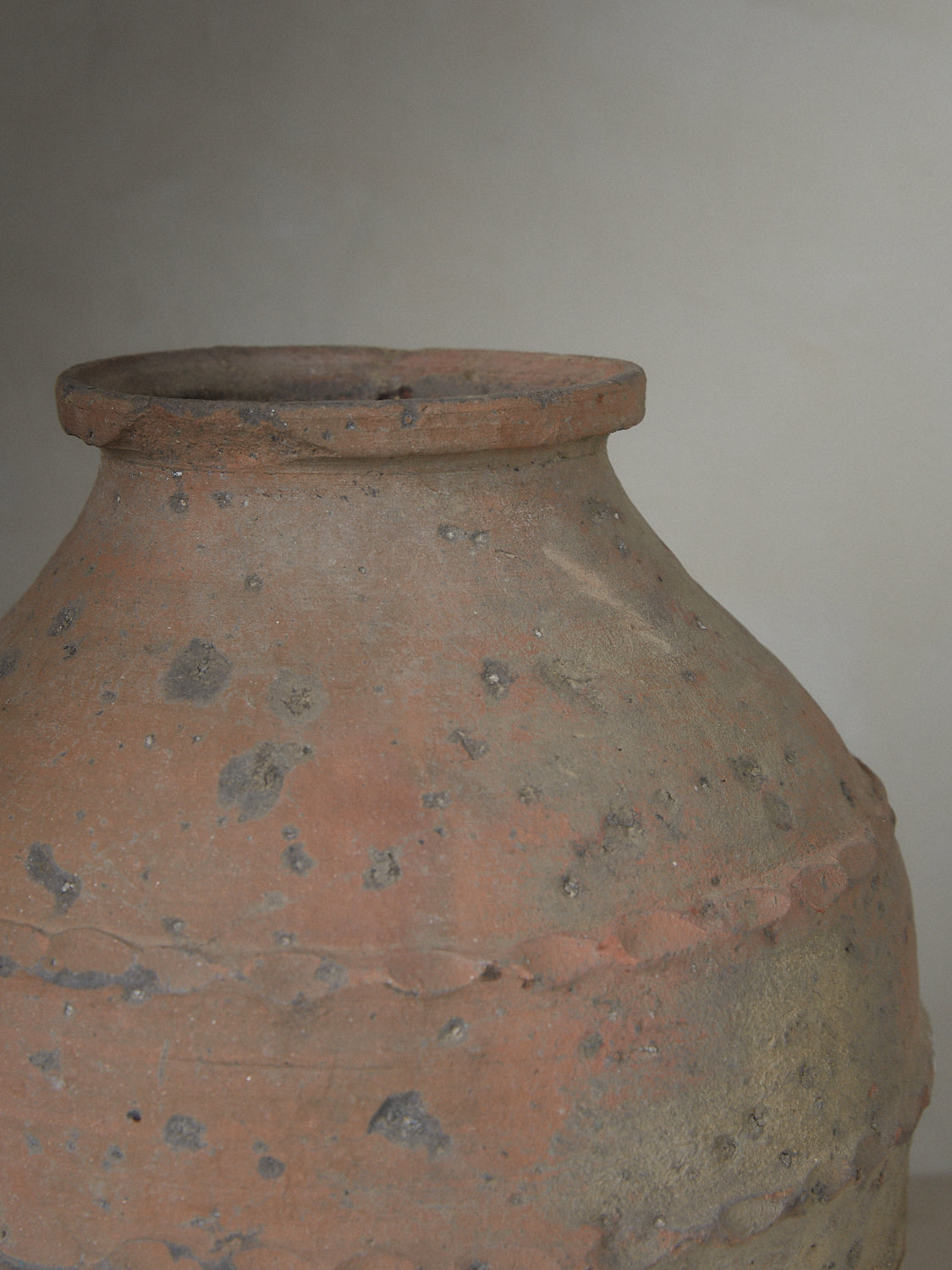 Authentic terracotta vintage vessel originally purposed for storing olive oil with banded braiding details throughout. 