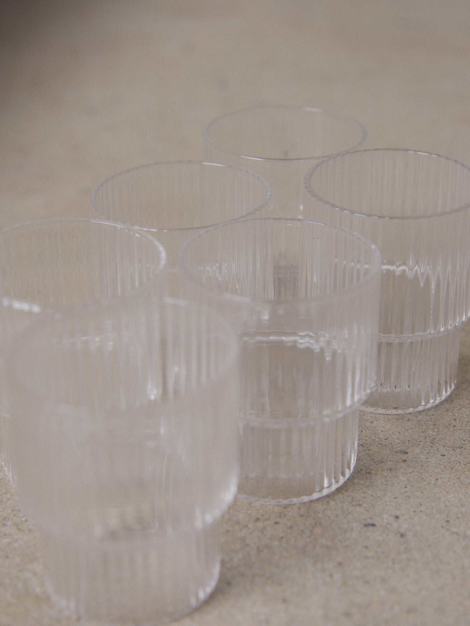 Ridge Shot Glass Set/6. A set of six unique shot glasses with geometric forms and a sophisticated vertical ridge surface in clear transparent glass