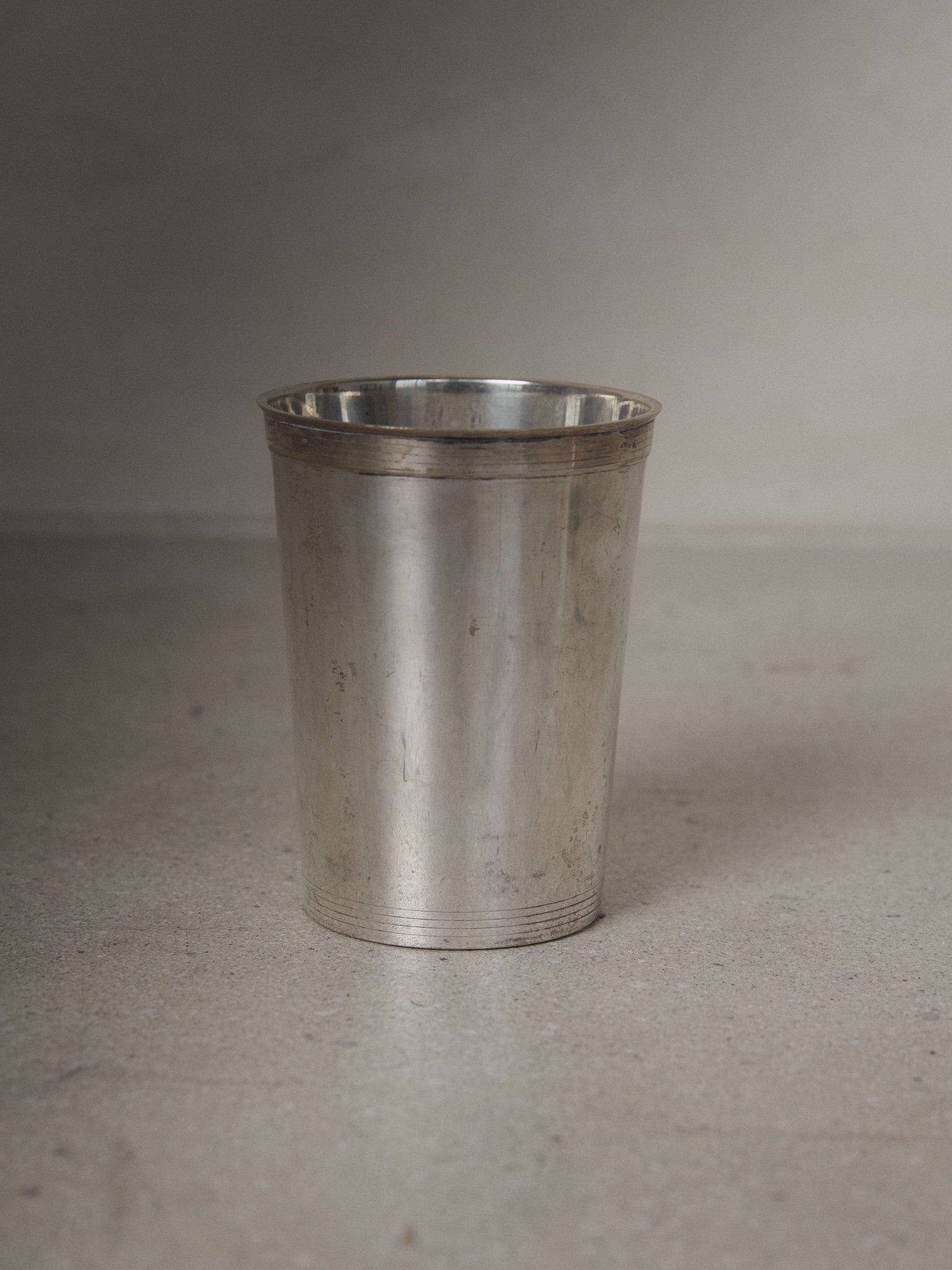 Squier. Rare vintage find. Vintage silver plated cup with tapered bodice and hand engraved, etched banding details at rim. 