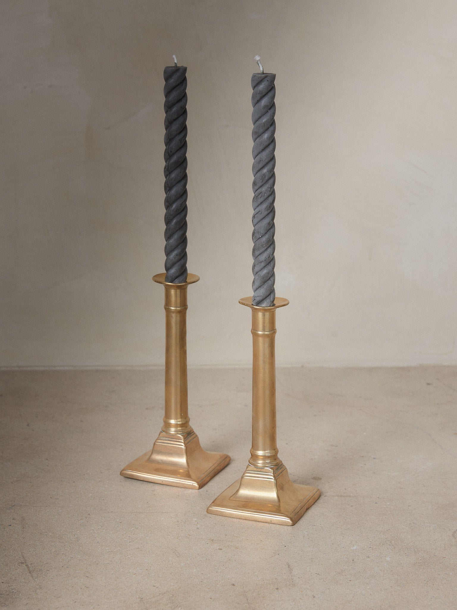 Pair of stately 19th century English column candle holders with push up mechanism in brass.