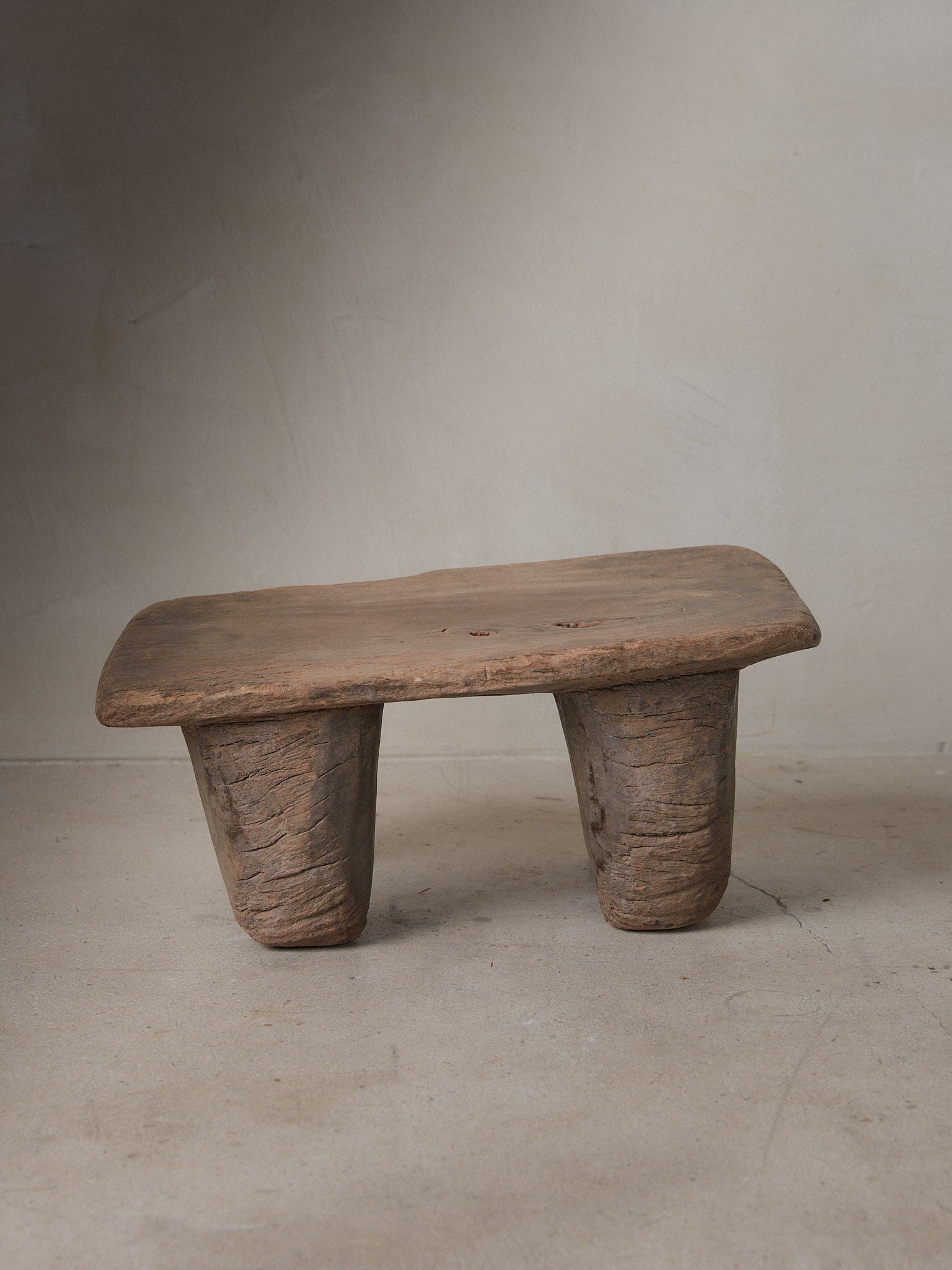 Vintage Senufo Stool. Small African Senufo stool with rectangle top and four rounded supporting legs from the Cote d'Ivoire. 