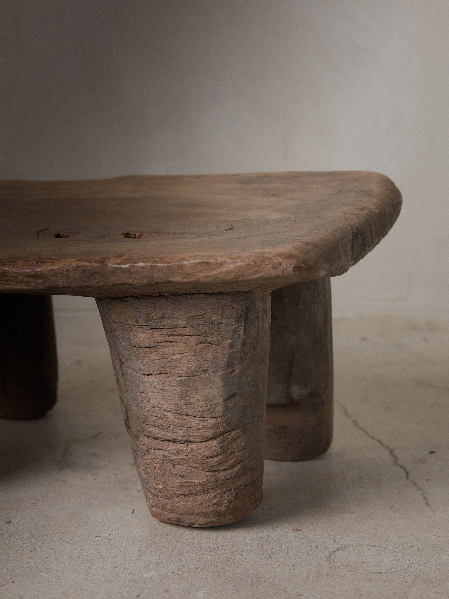 Vintage Senufo Stool. Small African Senufo stool with rectangle top and four rounded supporting legs from the Cote d'Ivoire. 