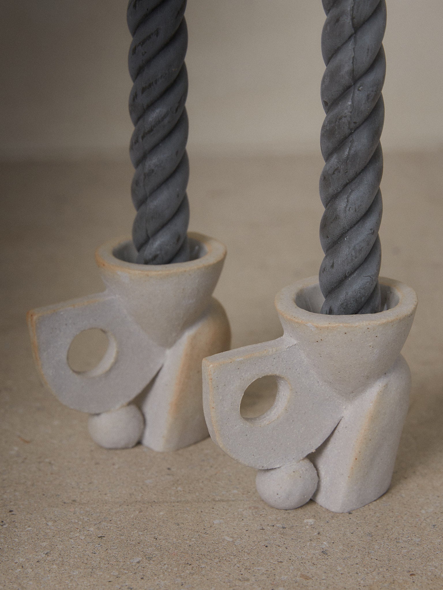 Build Candle Holder Pair. Sculptural abstract candleholders inspired by nature in natural grey ceramic stoneware. 