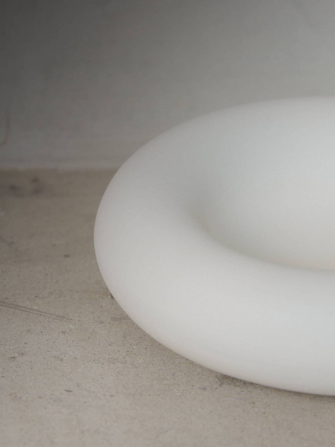 Holding Form. A decorative sculptural object embodying closeness and comfort in matte white..