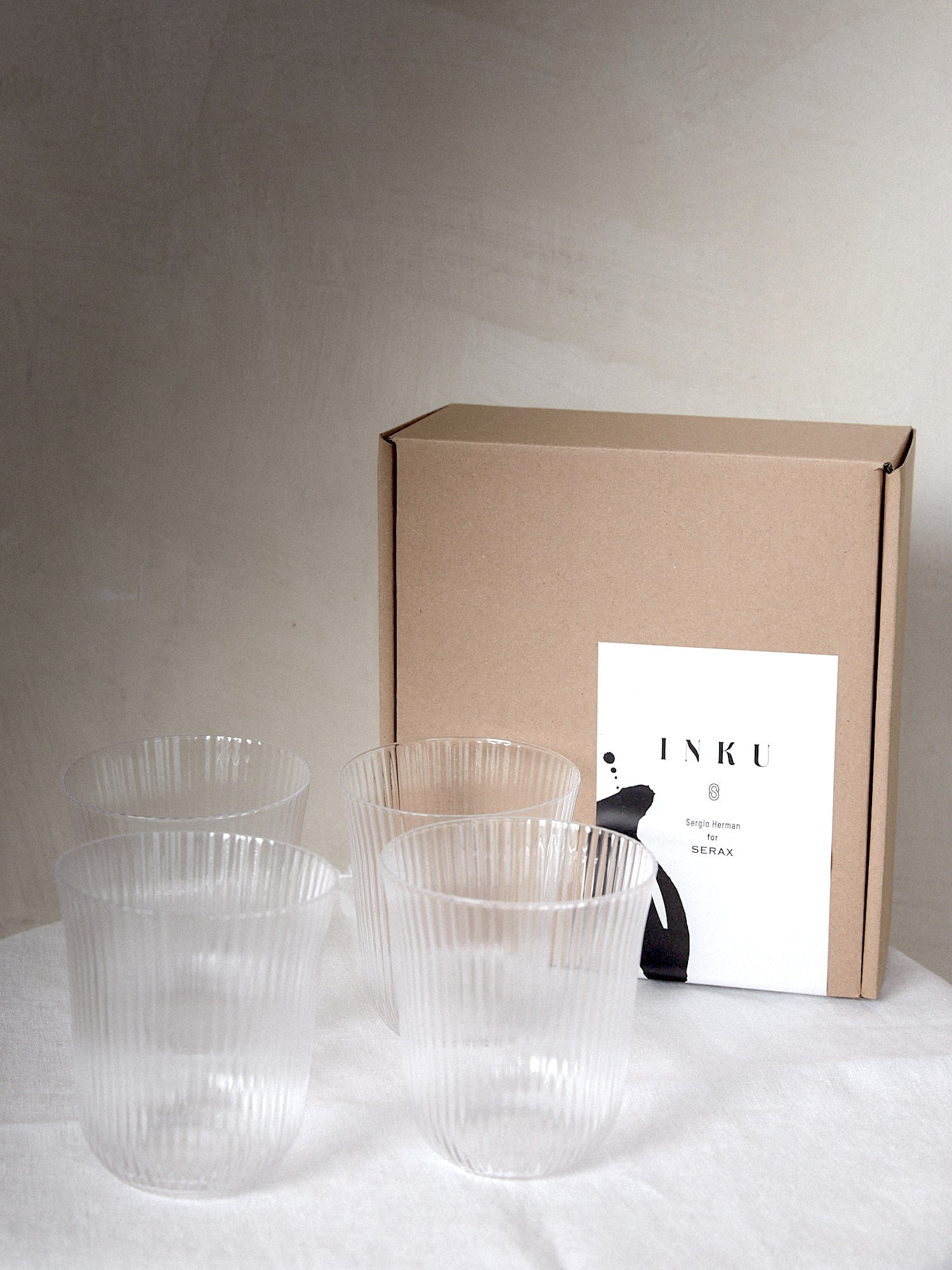 Large Tumbler Set/4. Unique find. Special edition set of ribbed drinking glasses designed by famed Michelin star chef and restauranteur, Sergio Herman, featuring delicate, tender folds fading to the edge of the glass. 