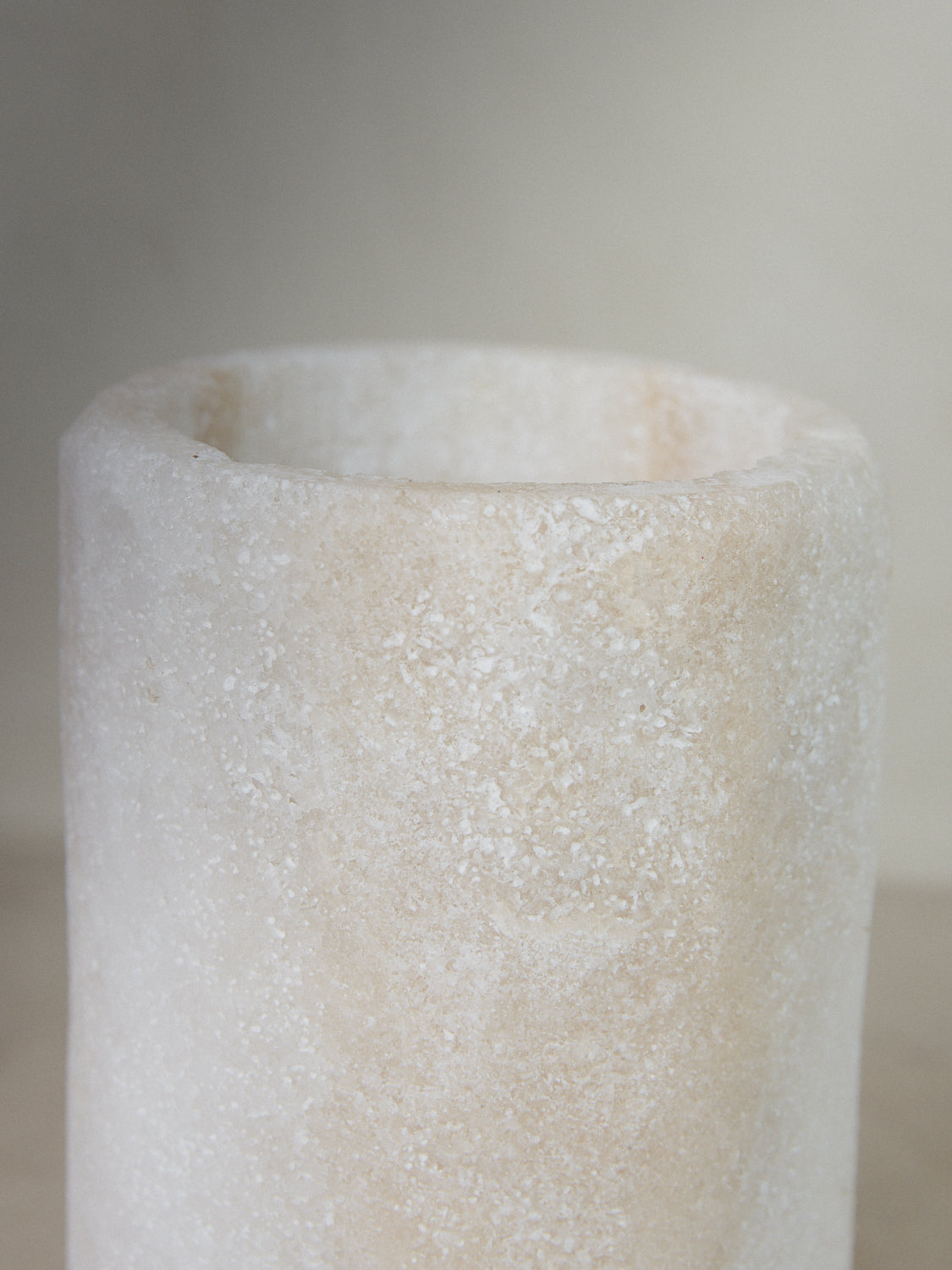 Large Salt Candleholder. Tall cylindrical candle holder emitting soft, filtered light through natural crystals hand carved of compressed salt