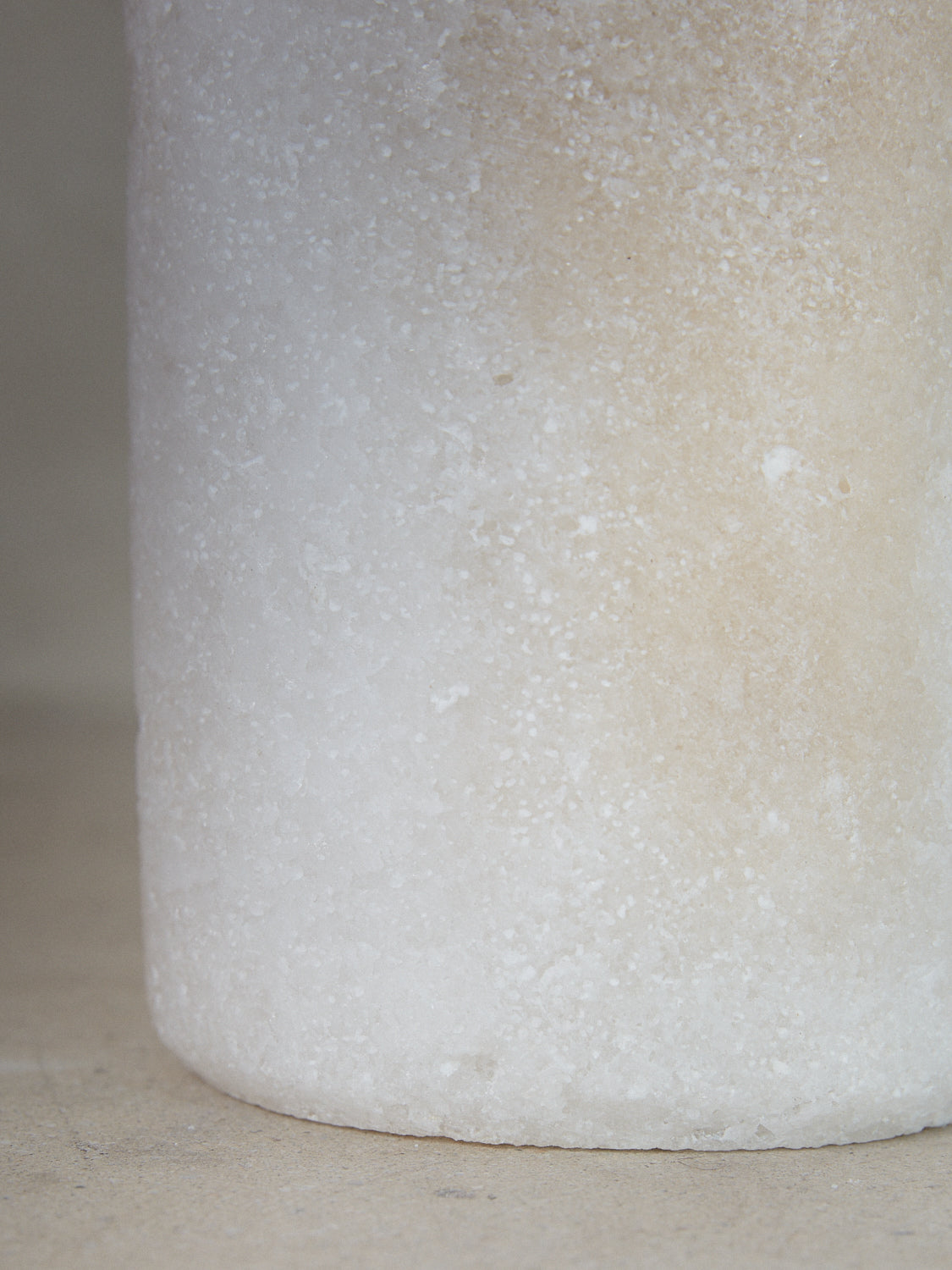 Large Salt Candleholder. Tall cylindrical candle holder emitting soft, filtered light through natural crystals hand carved of compressed salt