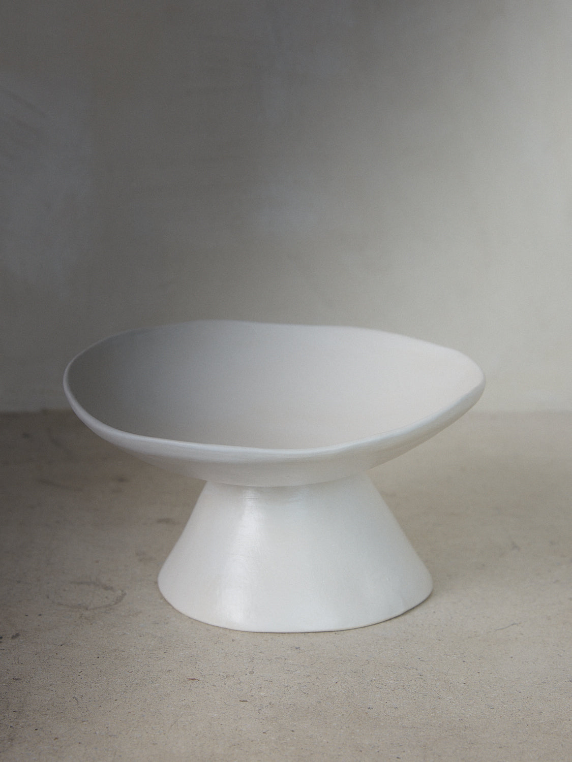 Raw Compote Pedestal. Exclusively ours. Handmade ceramic compote bowl with tapered pedestal foot base in a matte white finish.