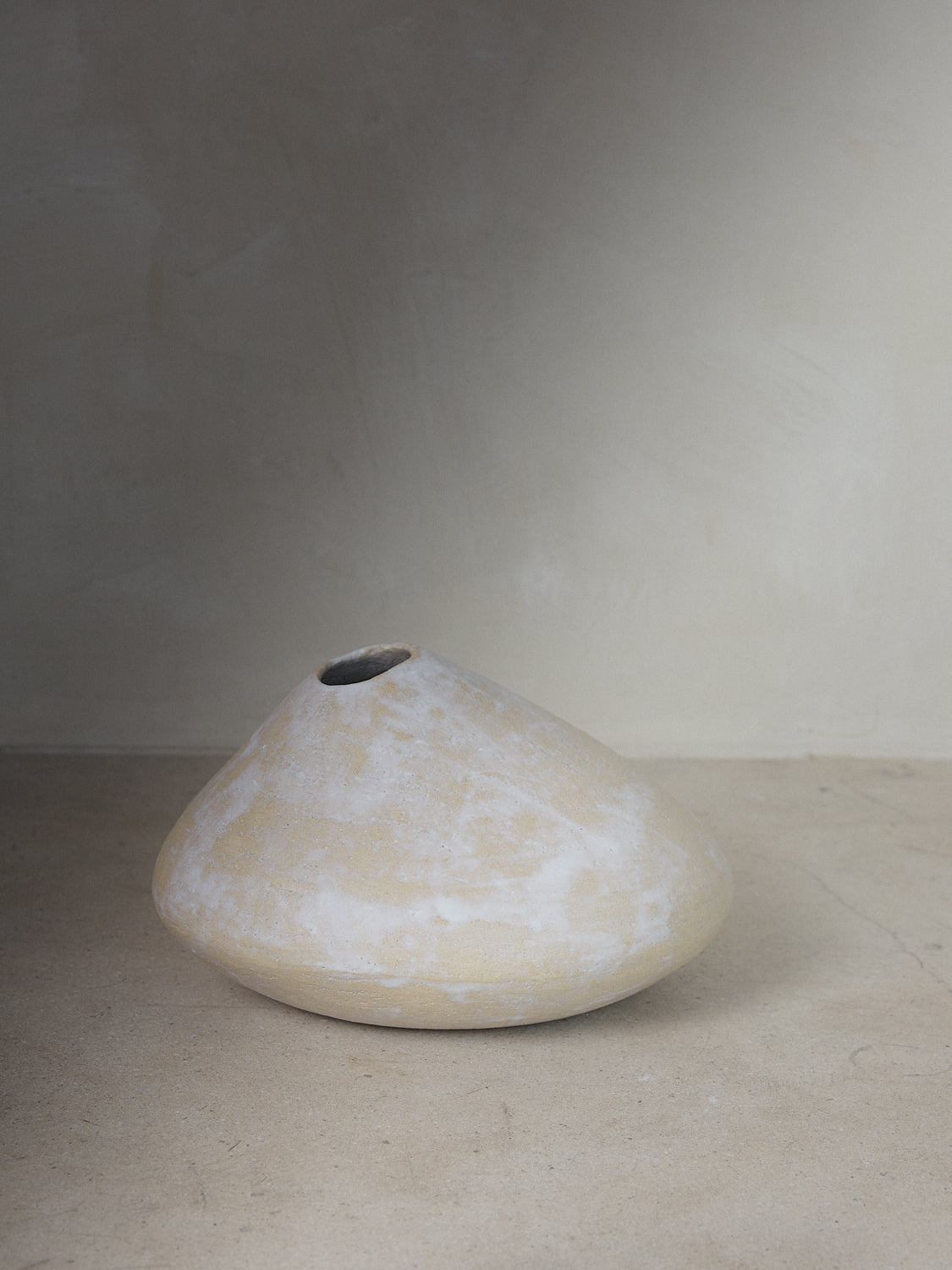 Raw Vase. Exclusively ours. A statement vase inspired by aged river rocks with an irregular oblong shape in a matte sand finish.