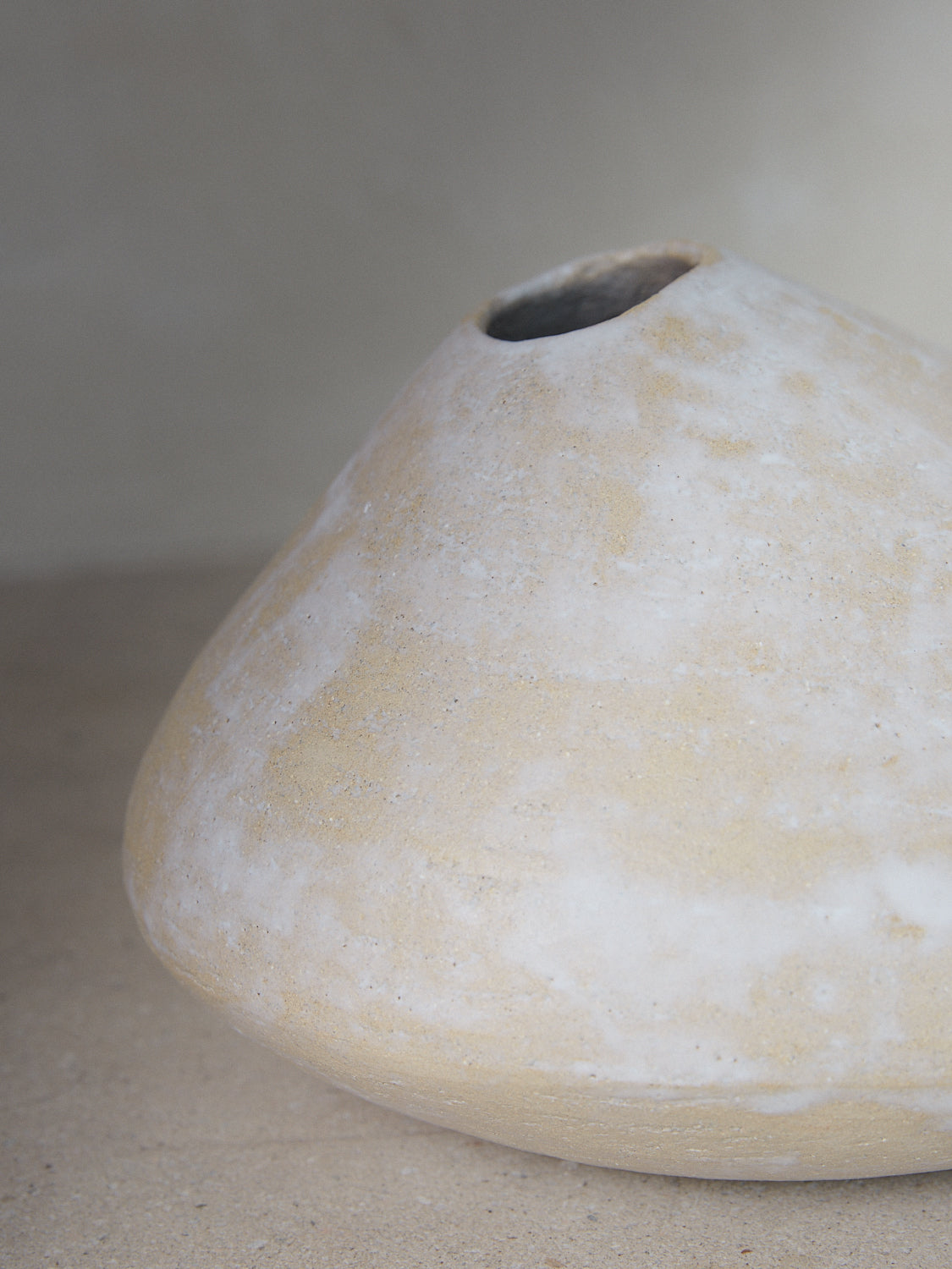 Raw Vase. Exclusively ours. A statement vase inspired by aged river rocks with an irregular oblong shape in a matte sand finish.