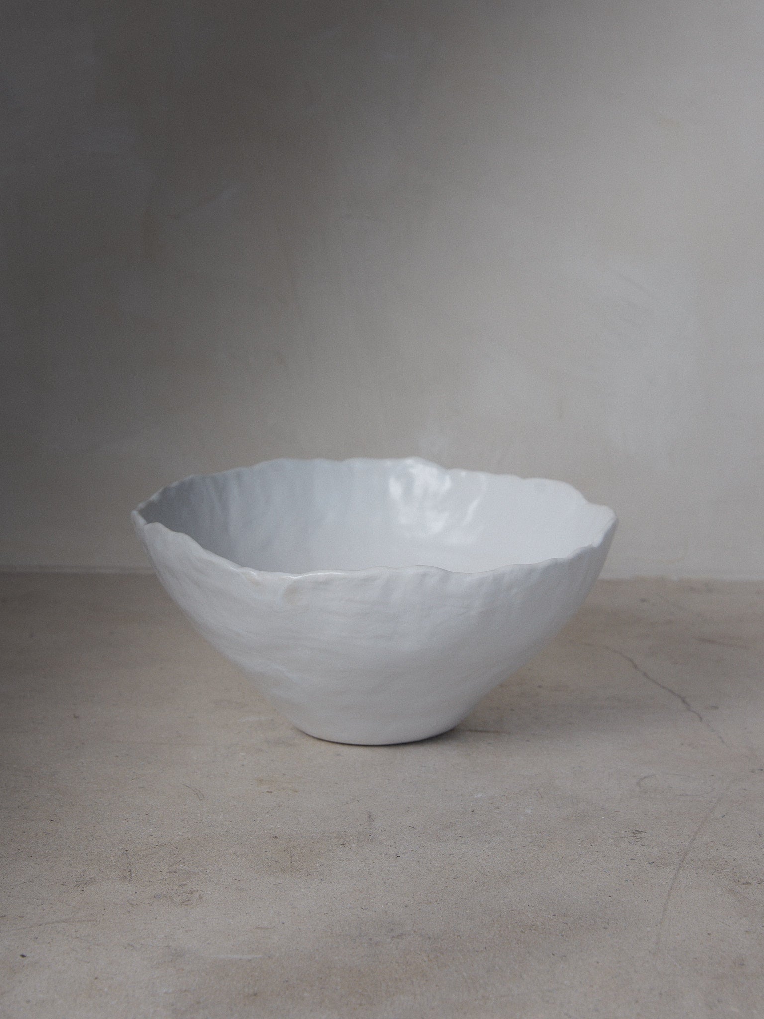 XL Raw Bowl. Exclusively ours. Timelessly elegant, oversize, ceramic bowl with subtly irregular edges revealing the touch of the artist's hand in classic matte white stoneware.